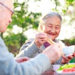 Husband and wife sharing dinner