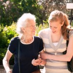 Mother and daughter walking arm-in-arm