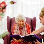 Female Care Advisor helping female Home Care Package client understand her home care agreement