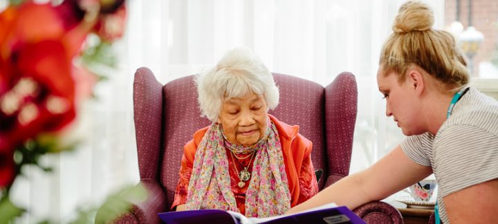 Female Care Advisor helping female Home Care Package client understand her home care agreement